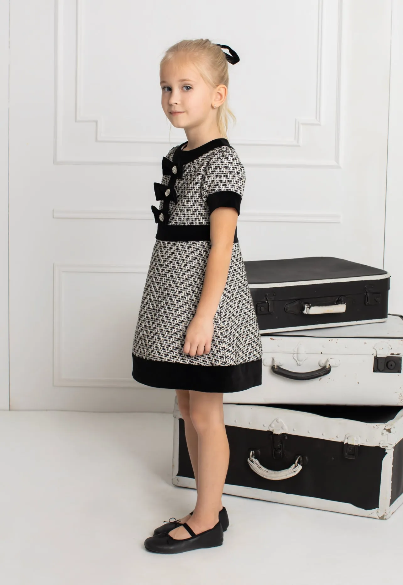 Beautiful girls Black and Ivory Tweed Dress with Bow details.