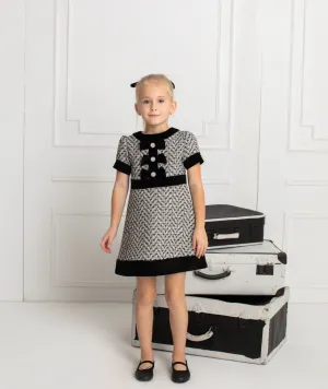 Beautiful girls Black and Ivory Tweed Dress with Bow details.