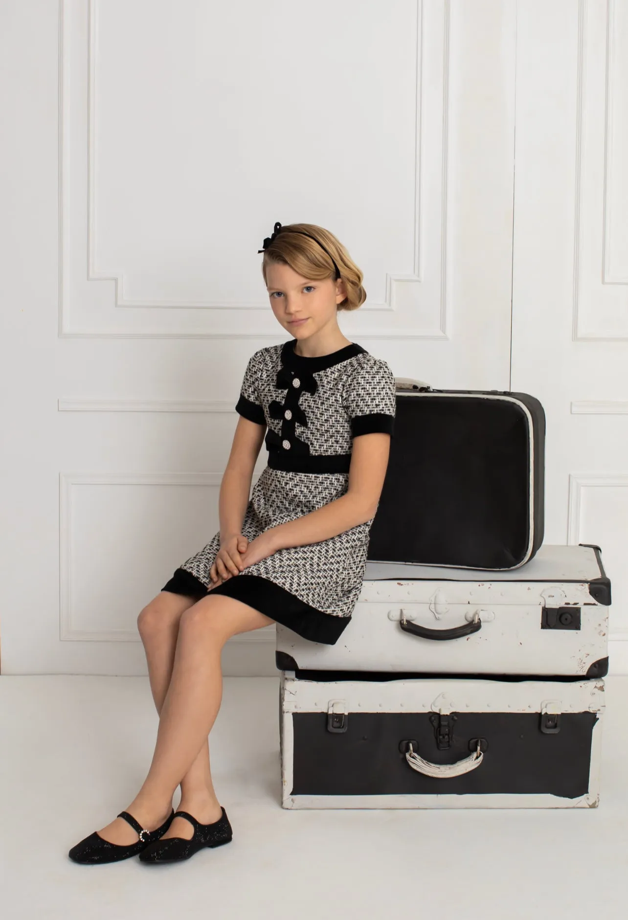Beautiful girls Black and Ivory Tweed Dress with Bow details.