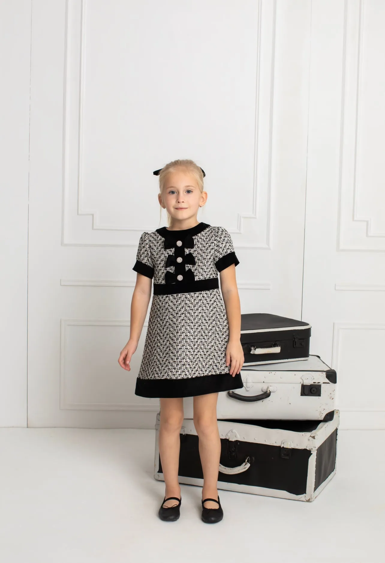 Beautiful girls Black and Ivory Tweed Dress with Bow details.