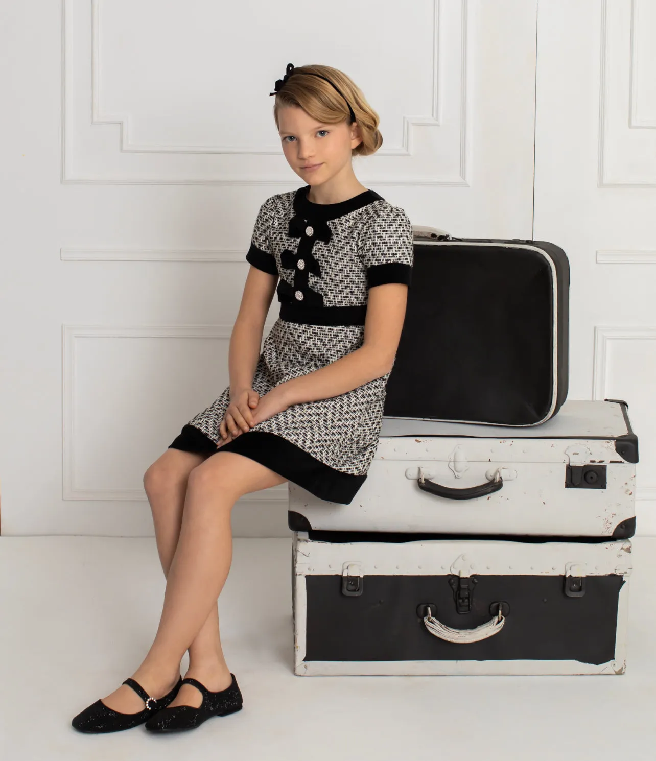 Beautiful girls Black and Ivory Tweed Dress with Bow details.